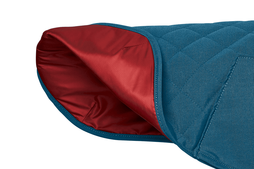 Blauer, gesteppter Hundemantel von Stumptown™ mit gepolsterter Innenseite für optimalen Komfort und Wärme.