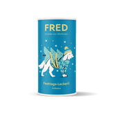 Runde, hellblaue Dose FRED Festtags-Leckerli für Hunde mit fröhlichem Hund und Schneeflocken, ideal für besondere Belohnungen