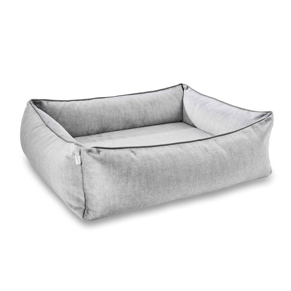 Grau-moderndes ORTHO Hundebett GLAM mit weicher Liegefläche und hohen, gepolsterten Seitenwänden für optimalen Komfort.