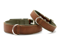 Braune Lederarmbänder mit silberner Schnalle und grünlicher Innenseite, robust und stilvoll.