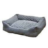 Graues Komfortbett "Diamond" für Hunde mit weichem Innenmaterial und erhöhten Seiten im Schachbrettdesign.