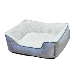 Komfortables rechteckiges Hundebett "TOFA" mit grauer Außenfläche und hellem, plüschigem Innenfutter.