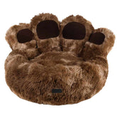 Gemütliches Komfortbett "Paw" in Pfotenform aus braunem, fusselfreiem Material für Hunde.
