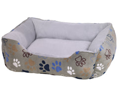 "Hundebett Classic 'Lissi' in Beige mit bunten Pfotenabdrücken und grauem Innenfutter für besten Komfort."