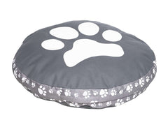 Rundes Hundekissen "Zampa" in Grau mit Pfotenabdruck und dekorativen Pfotenmotiven am Rand. Ideal für Komfort und Stil.