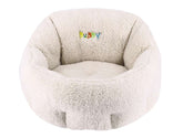 Komfortables ovales Hundebett "Puppy" in creme mit plüschiger Textur und erhöhter Rückenlehne für entspannte Kuschelstunden.