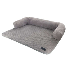Hundefreundliches Bett "Penka" mit grauer, weicher Liegefläche und hohen, gepolsterten Seitenrücken für optimalen Komfort.