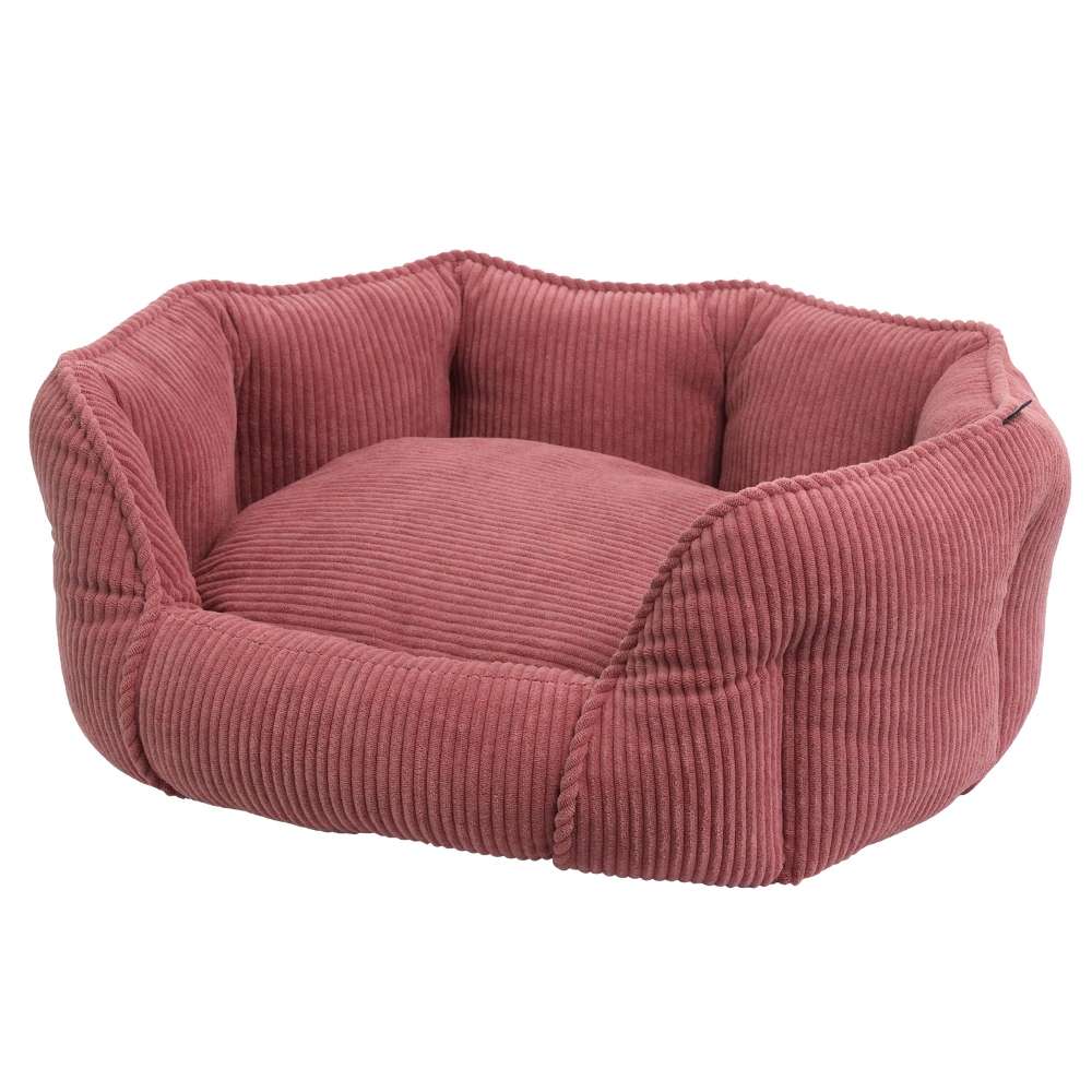 Komfortbett oval „Salia“ in rötlichem Farbton, hundeförmig, mit rippeliger Textur für Geborgenheit und weichen Bezug.