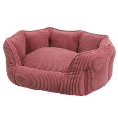 Komfortbett oval „Salia“ in rötlichem Farbton, hundeförmig, mit rippeliger Textur für Geborgenheit und weichen Bezug.
