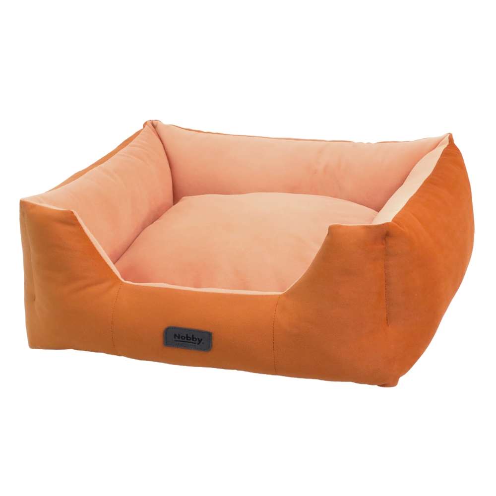 Komfortbett "Cumba" für Hunde mit orangem Außenbezug und weicher, heller Innenpolsterung. Ideal für gemütliche Ruhezeiten.