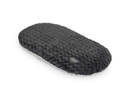 Ovales Kissen "SEOLI" aus weichem Plüsch mit strukturierter Oberfläche und Logo am Rand. Ideal für Komfort und stilvolle Akzente.