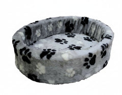 Rundes Plüschbett "Pfote" mit grauem Stoff und dekorativen schwarzen und weißen Pfotenabdrücken, ideal für Tiere.