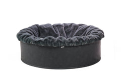Rundes Hundebett mit grauem Plüschrand und robustem dunkelgrauen Boden für gemütliche Ruhezeiten.