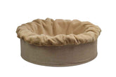Rundes, beiges Hundebett Buddelnest® mit weichem Stoffbezug und knuddeligem Rand für optimalen Komfort.
