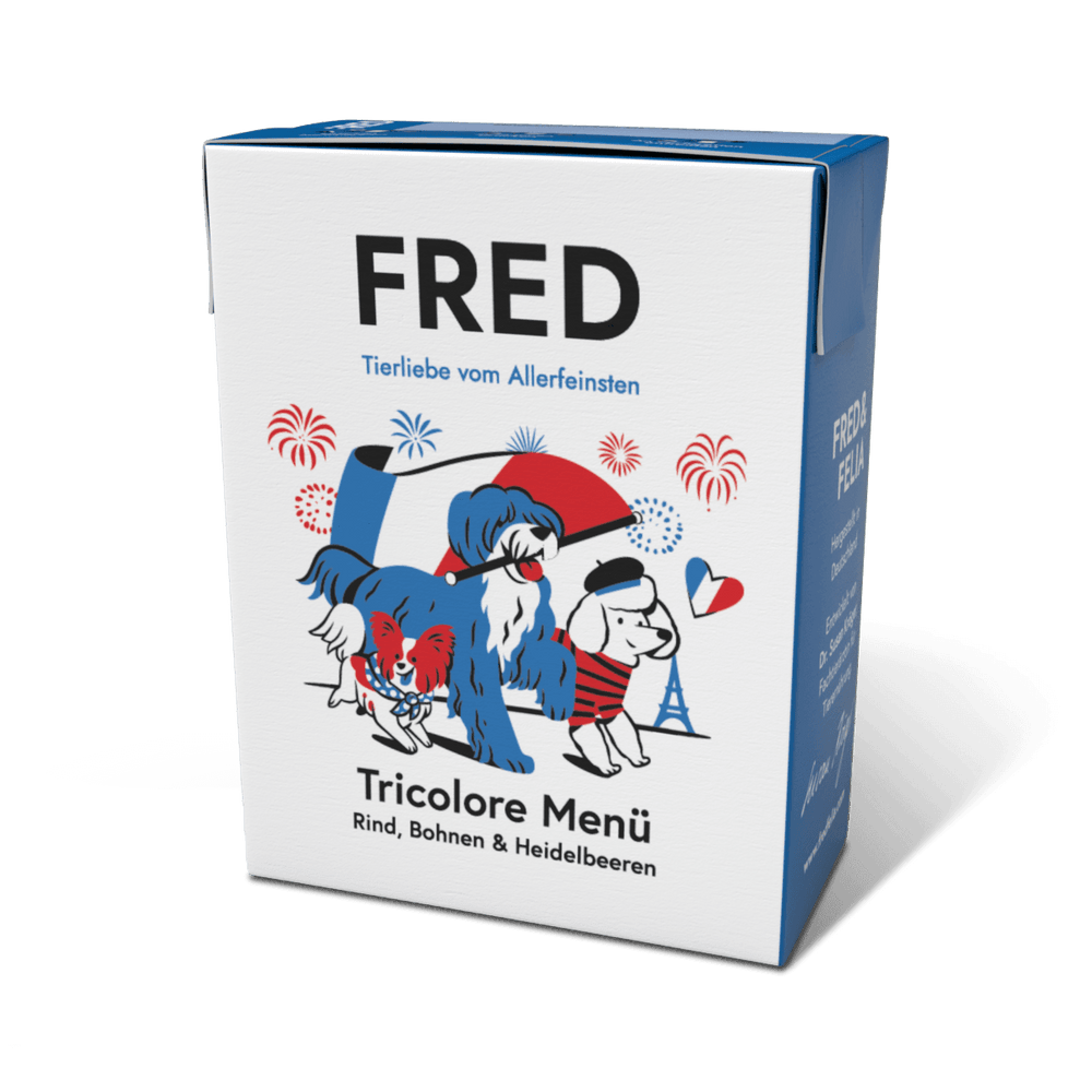 Verpackung des FRED Tricolore Menüs mit Hundeillustrationen und französischen Symbolen wie dem Eiffelturm.