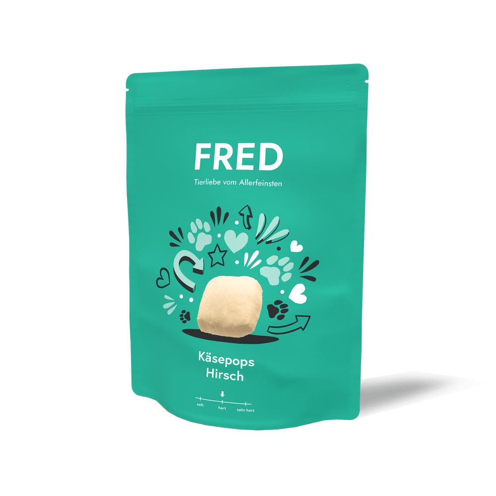 Grüne Verpackung von FRED Käsepops Hirsch mit bunten Symbolen und kreativem Design.