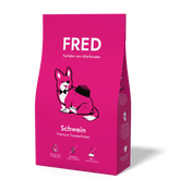FRED Premium Trockenfutter für Hunde mit Schweinefleisch in pinker Verpackung, getreidefrei und nährstoffreich.