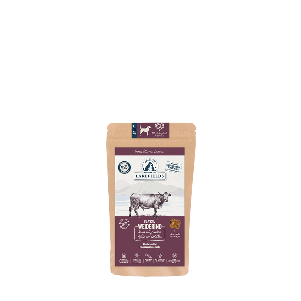 Braune Tüte mit Lakefields Hundefutter, Rind, zeigt Kuh, Qualitätszeichen und "neu"-Label. Ideal für adulte Hunde.