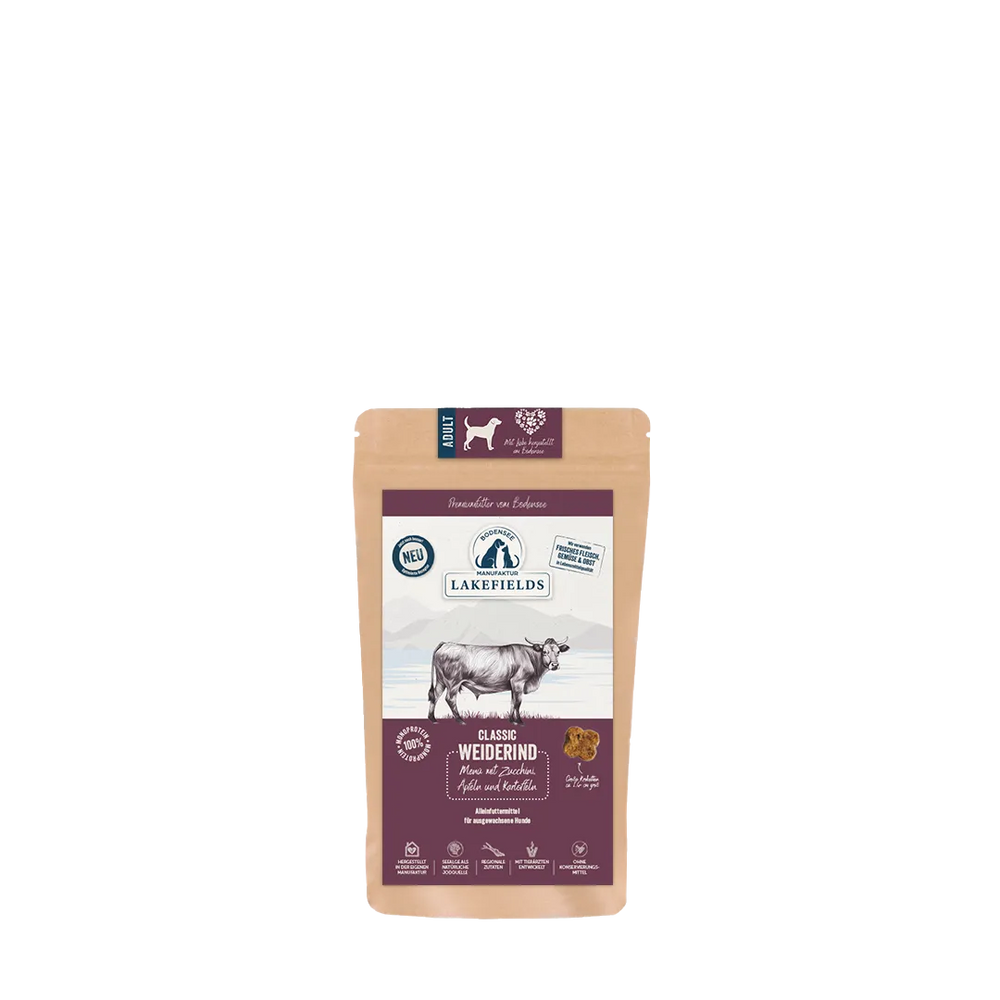 Braune Tüte mit Lakefields Hundefutter, Rind, zeigt Kuh, Qualitätszeichen und "neu"-Label. Ideal für adulte Hunde.