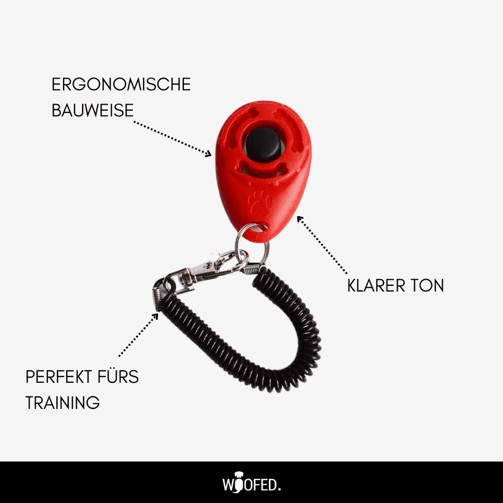 Roter Hunde-Clicker zur Erziehung, ergonomisch geformt mit klaren Klang, Clip und Spiralband für einfache Handhabung.