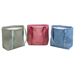 Einkaufstasche Zhero Tote in Grün, Rosa und Blau mit Tragegriffen und Muster, schlichtes rechteckiges Design, abgerundete Ecken.