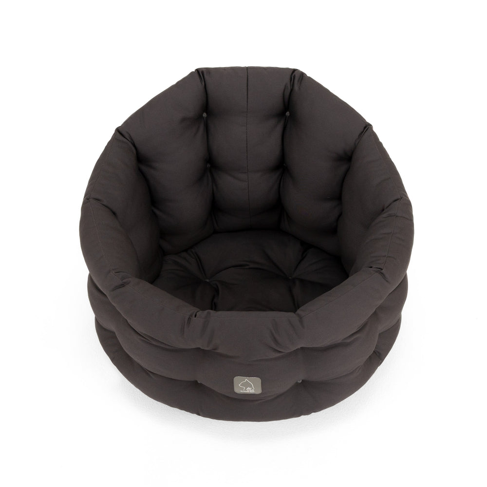 Schwarzes, rundes Katzenbett Deluxe mit hoher Umrandung und plüschigem Innenbereich für maximalen Komfort.