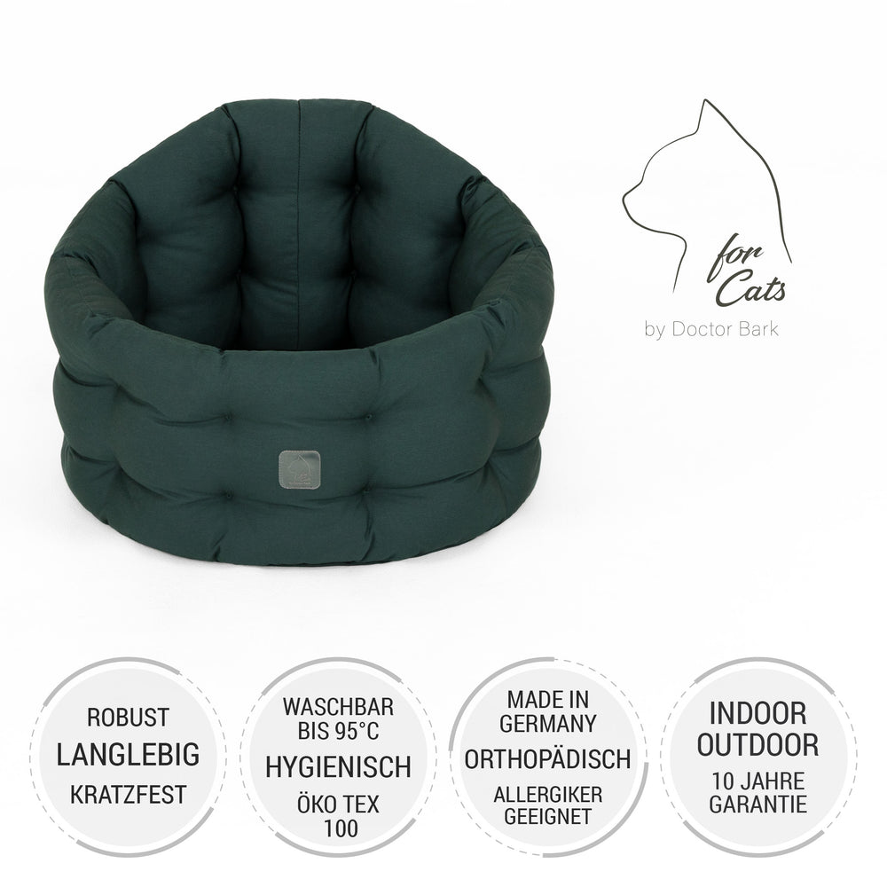 Dunkelgrünes, rundes Katzenbett aus robustem Material, weich gepolstert und kratzfest für optimalen Komfort.