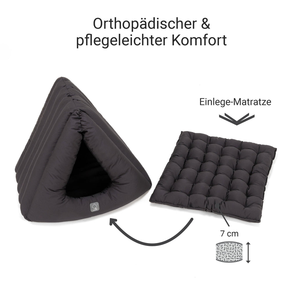 Orthopädisches Katzenhaus in Dreiecksform mit gepolsterter Matratze in dunklem Farbton für optimalen Komfort.