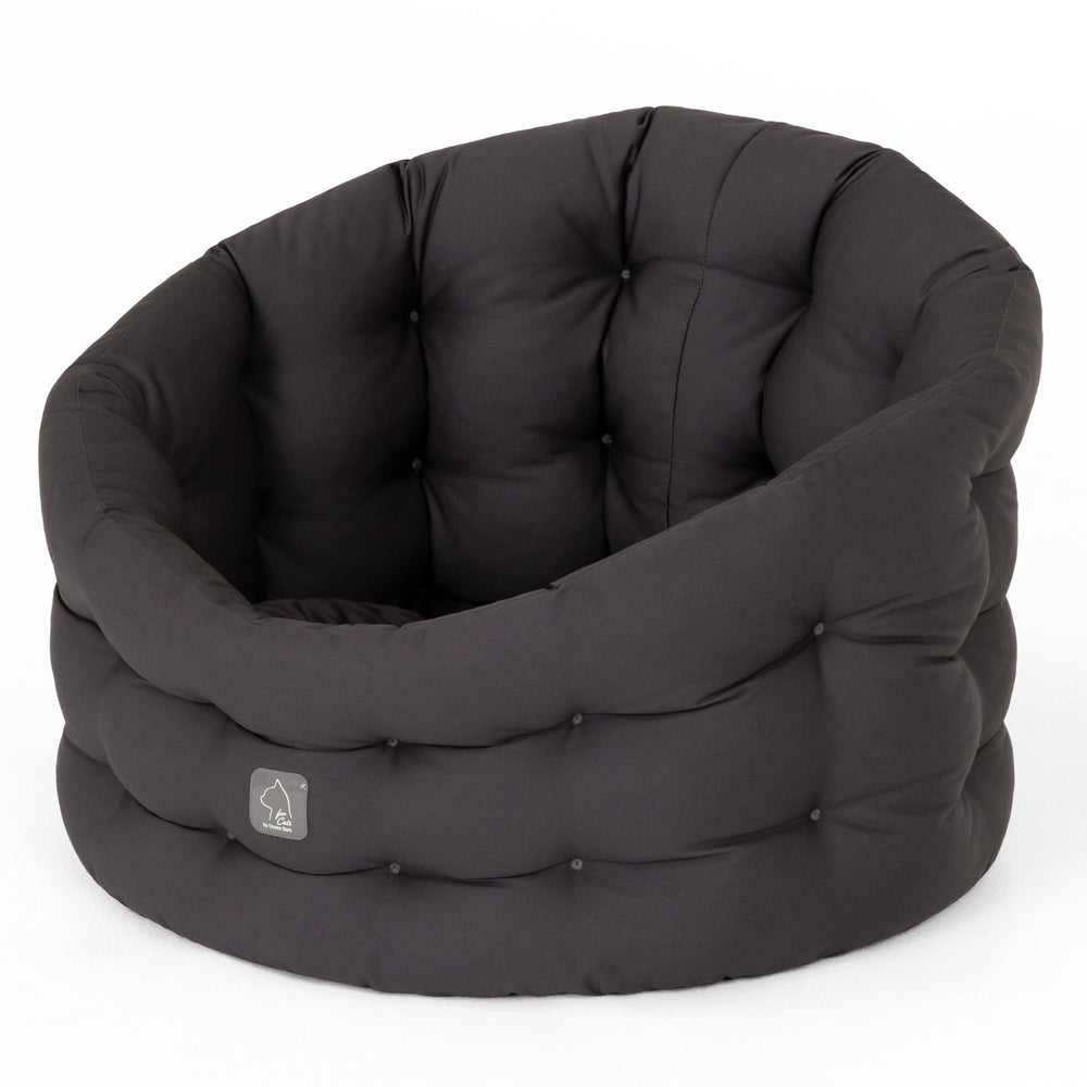 Rundes schwarz gepolstertes Katzenbett Deluxe mit weicher Oberfläche für optimalen Komfort und Entspannung.