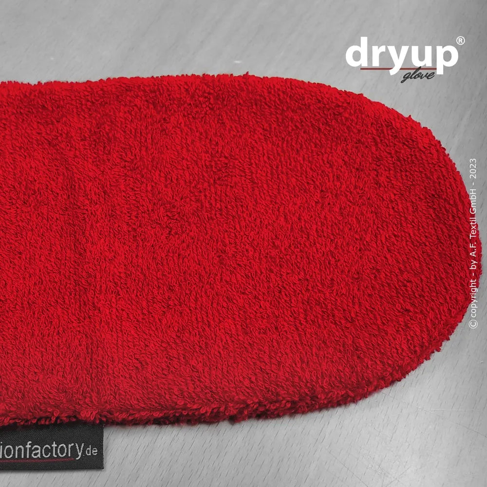 Roter, gepolsterter Dryup® Handschuh aus weichem, texturiertem Material mit abgerundeter Kante und flauschiger Oberfläche.