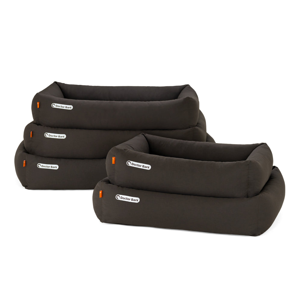 Orthopädische Hundebetten in verschiedenen Größen, dunkel gepolstert mit erhöhten Rändern für optimalen Komfort.