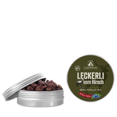 Hunde-Leckerli vom Hirsch in dekorativer Dose mit teilweise geöffnetem Deckel, ideal für vierbeinige Freunde.