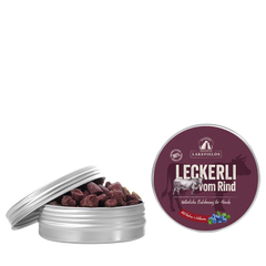 Silberne Dose mit Hundeleckerlis aus Weiderind, teilweise geöffnet, mit dem Aufdruck „Leckerli vom Rind“.