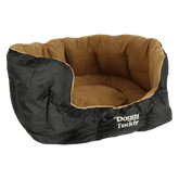 Ovales Hundebett "Doggy Teddy X-Treme" mit schwarzer Außenseite und braunem, weichem Innenleben.