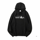 Unisex Hoodie mit Aufdruck "F*** humans love dogs", schwarz mit Kapuze und Kängurutasche, ideal für Hundeliebhaber.