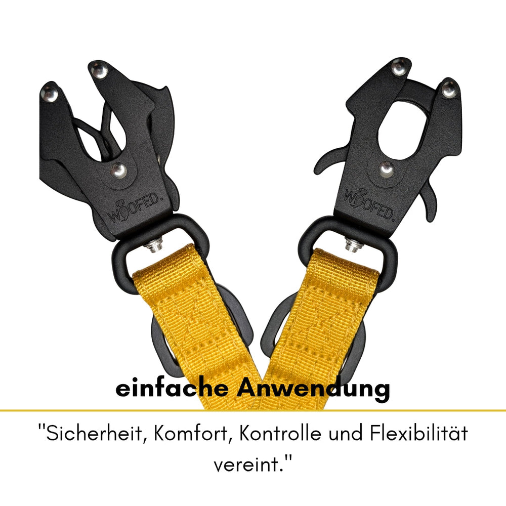 Schwarze Clips mit gelbem Riemen für Hunde, betont Sicherheit und Komfort, ideal für eine einfache Anwendung.