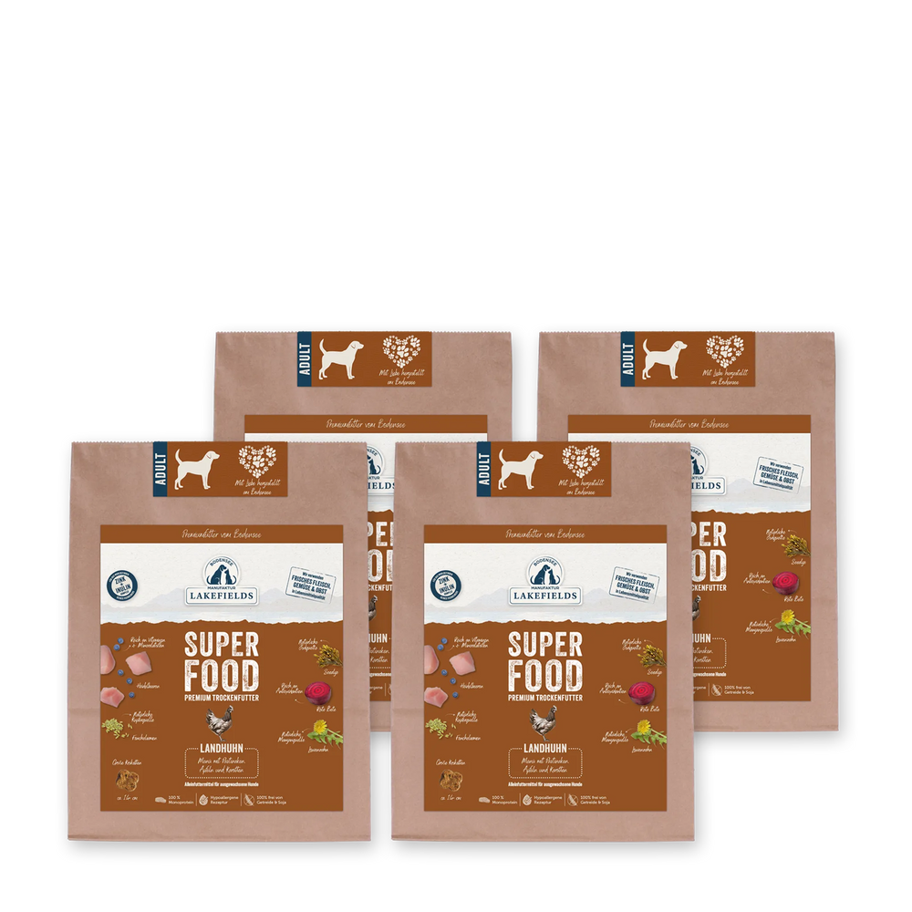 Verpackungen von Lakefields Hundefutter mit Superfood Huhn, ideal für adulte Hunde, in braunem Design.