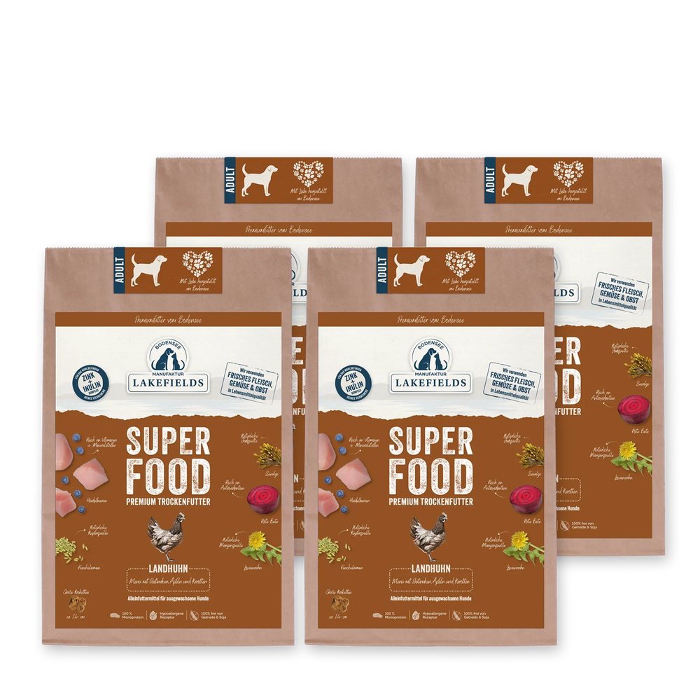 Verpackungen des Trockenfutters SUPERFOOD Huhn für Hunde in verschiedenen Farben mit Zutateninfos.