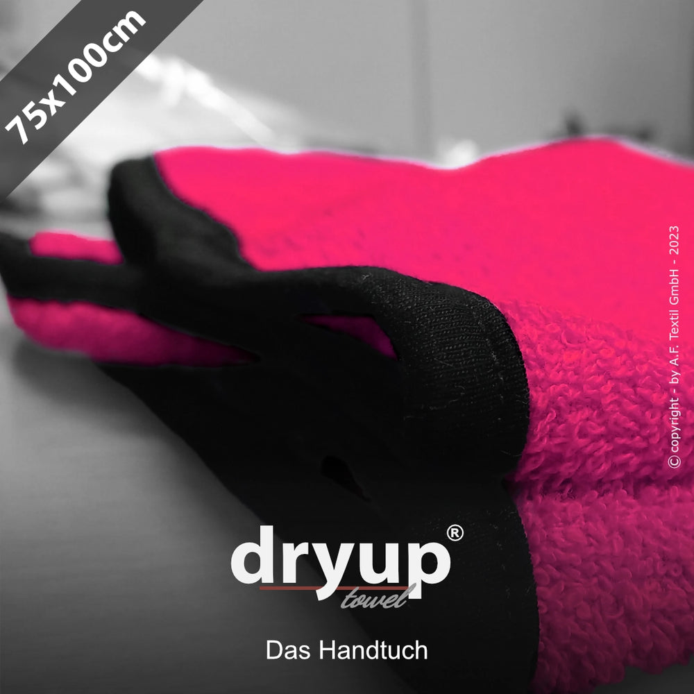 Pinkes Dryup® Handtuch mit schwarzen Rändern, 75 x 100 cm, mit Logo und Schriftzug "Das Hand" im Vordergrund.