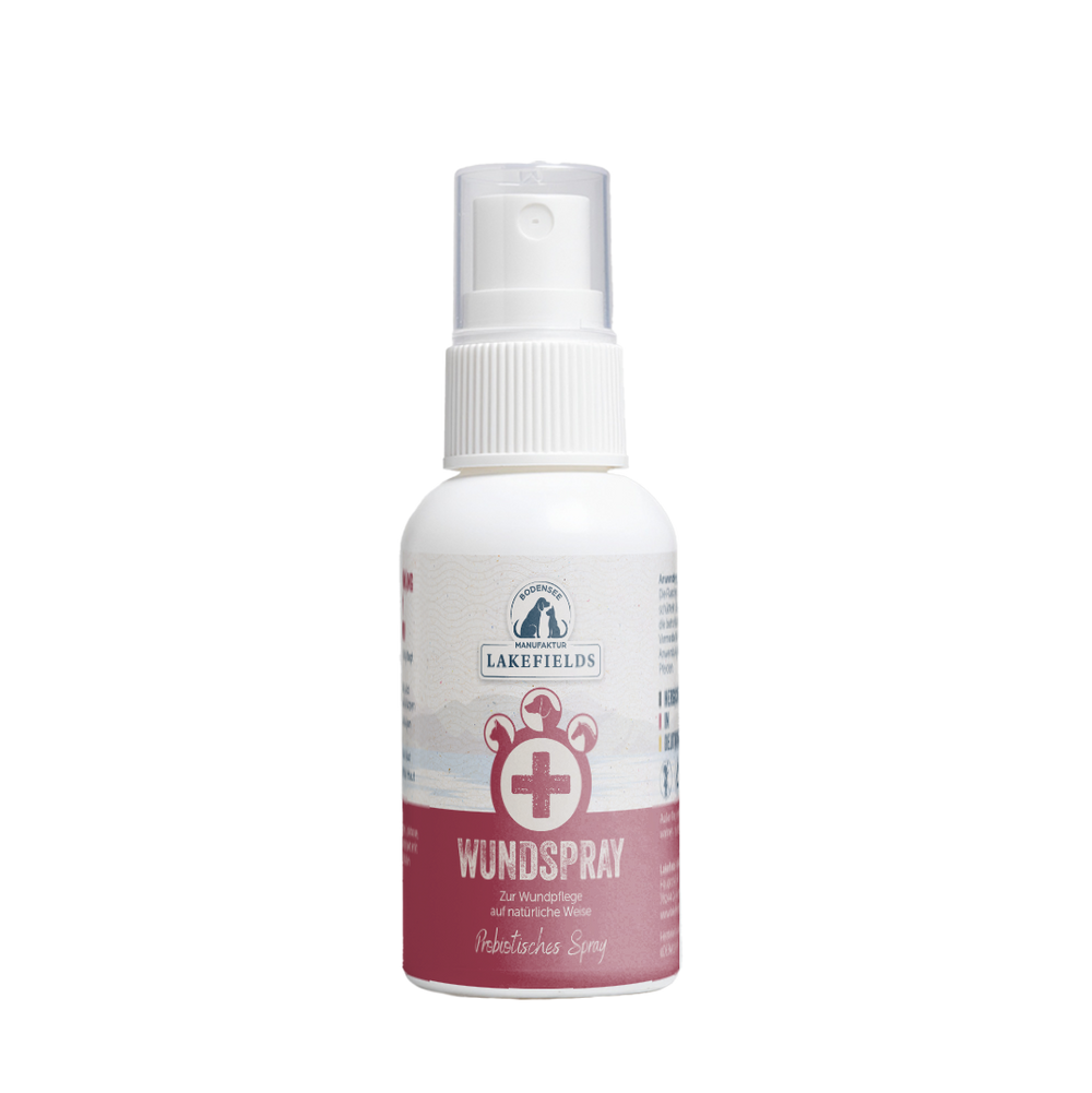Probiotisches Wundspray von Lakefields in weißer Flasche mit pinkem Etikett und Sprühkopf für sanfte Wundpflege.