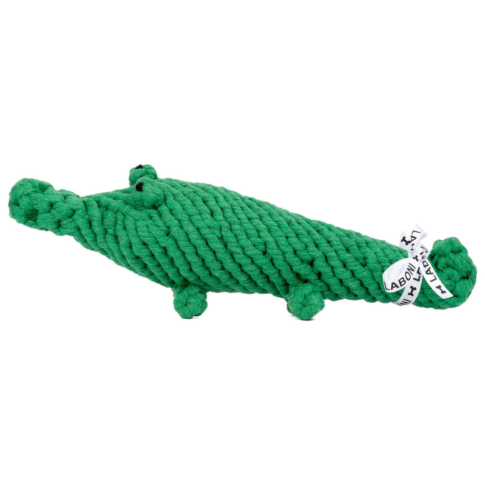 Kalli Krokodil - grünes, plüschiges Hundespielzeug aus geflochtenem Material mit Augen und Füßen.