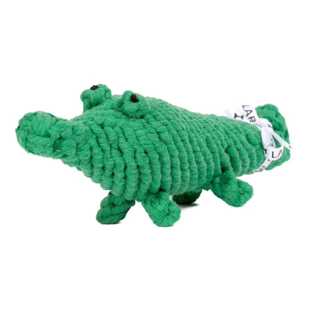 "Kalli Krokodil: weiches, geflochtenes Spielzeug für Hunde in Krokodilform mit Augen und kleinen Beinen."