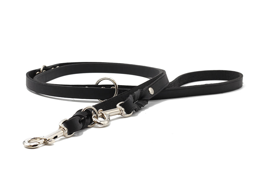 Schwarze Lederleine für Hunde, 2m lang, mit eleganten Metallbeschlägen und Karabinerhaken für sicheren Halt.