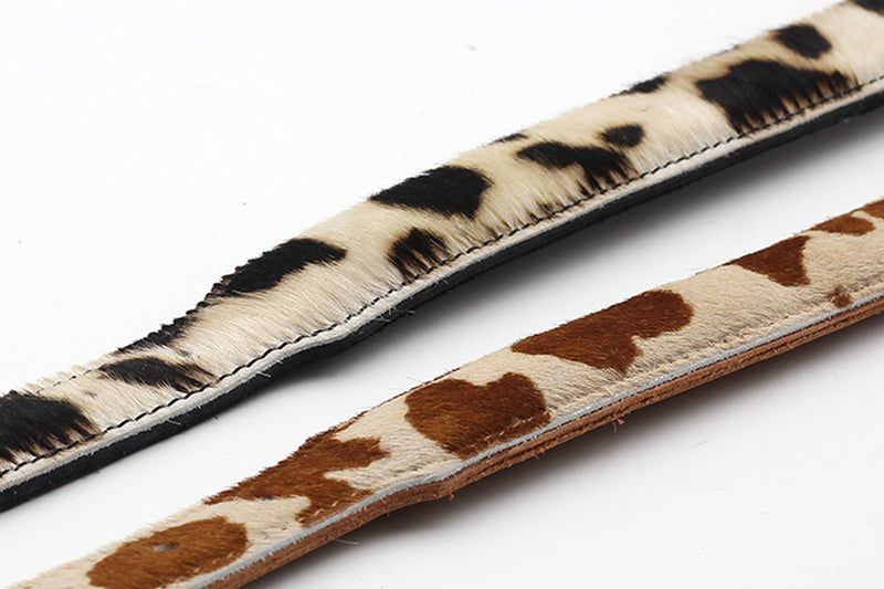 Halsband aus Kuhfellimitat in verschiedenen Tiermustern, ideal für stylische Hundebesitzer.