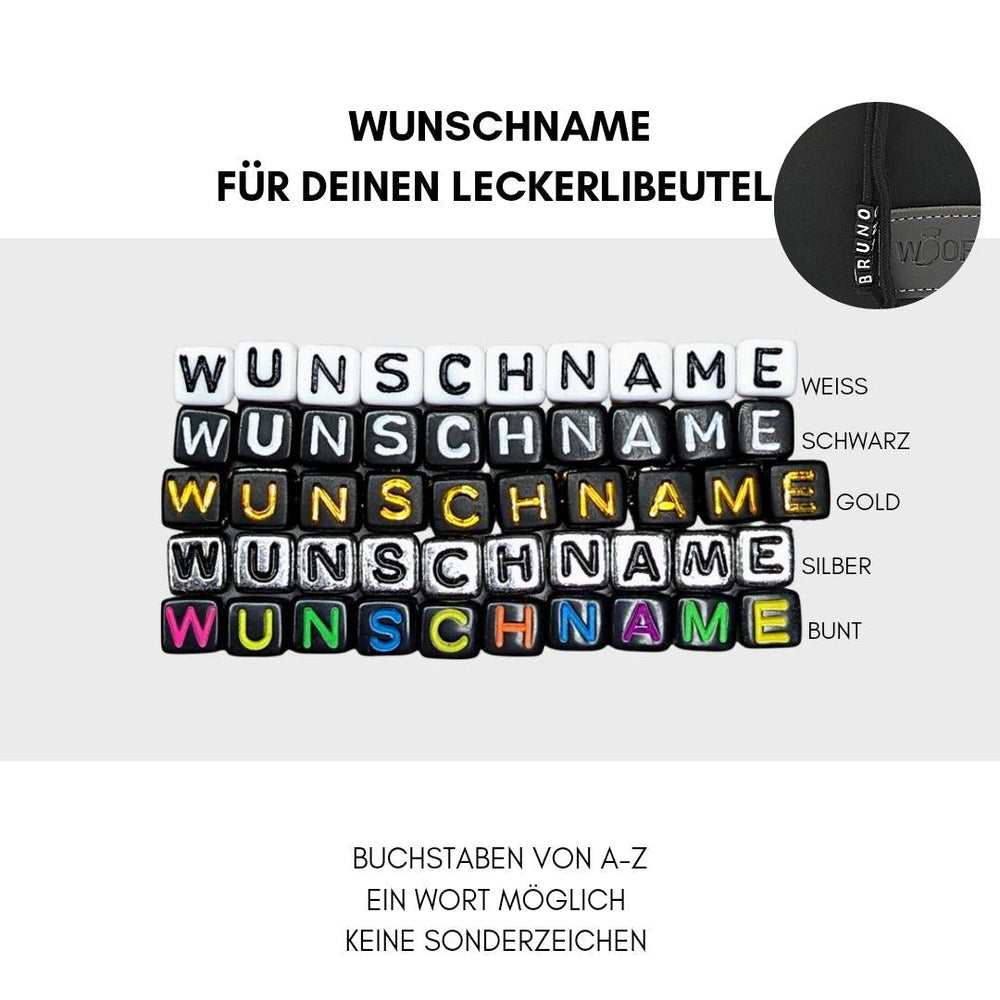 "Bunte Buchstabenwürfel in Weiß, Schwarz, Gold und Silber mit der Aufschrift 'WUNSCHNAME' in einer kreativen Anordnung."