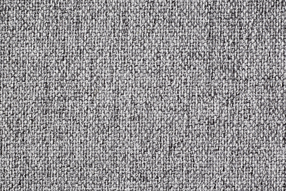 Graues ORTHO Hundebett VITO mit körniger, dicht gewebter Textur für optimalen Komfort und stilvolles Design.