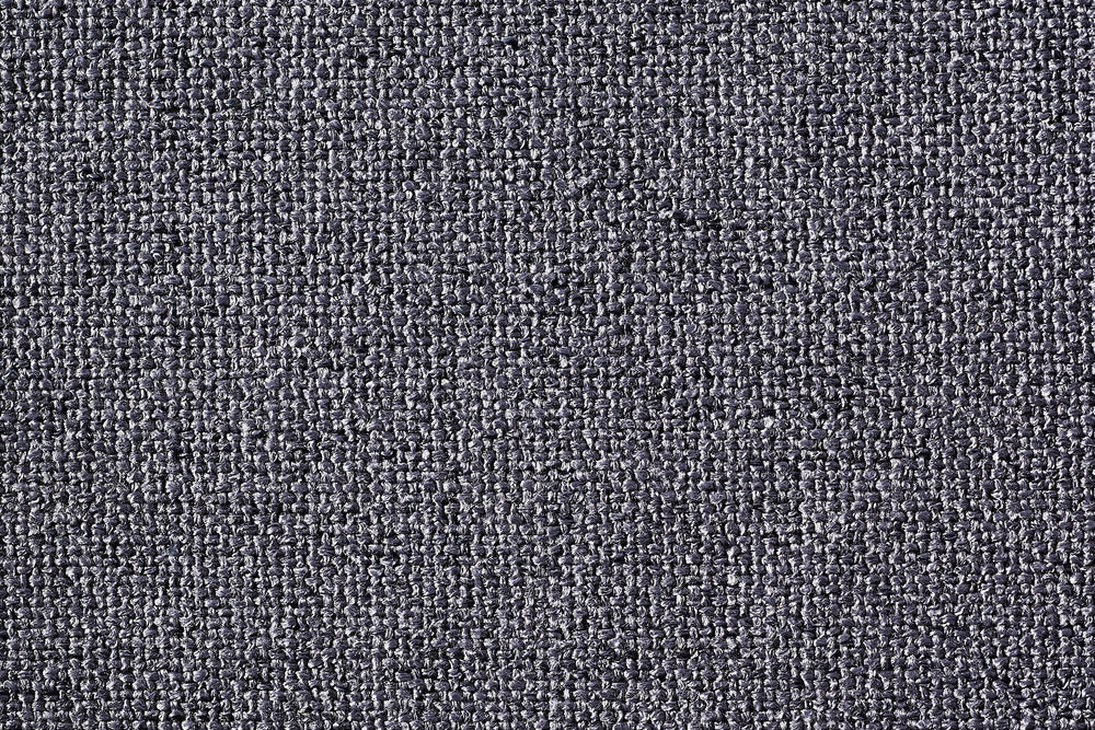 Dunkelgraue, eng gewebte Stoffoberfläche eines ORTHO Hundebetts, robust und strukturiert mit sichtbaren Fäden.