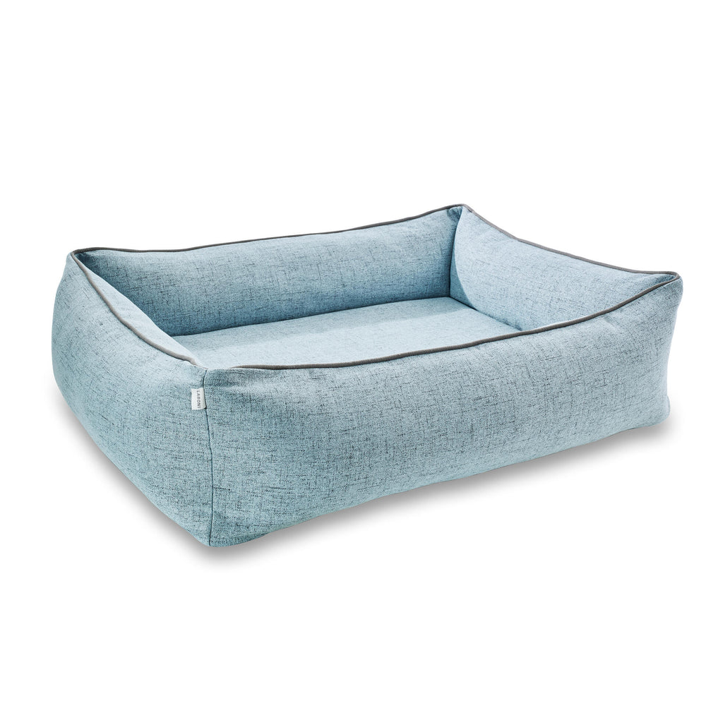 Hundebett ORTHO VITO in hellblau mit weicher Innenpolsterung und erhöhtem Rand für optimalen Komfort.