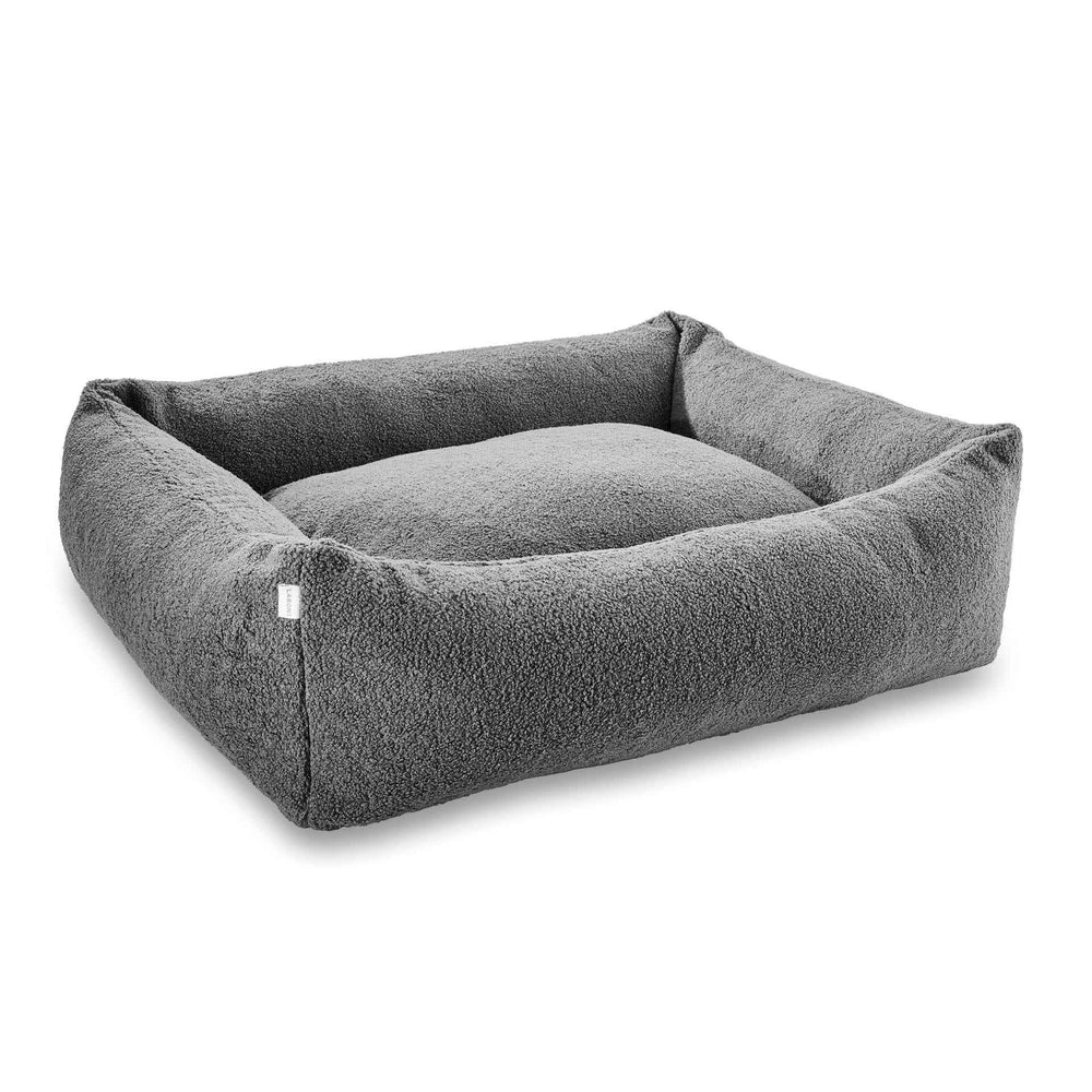 "Gemütliches graues Hundebett CLASSIC TEDDY mit flauschigem Bezug und hohen, gepolsterten Seiten für Hundekomfort."