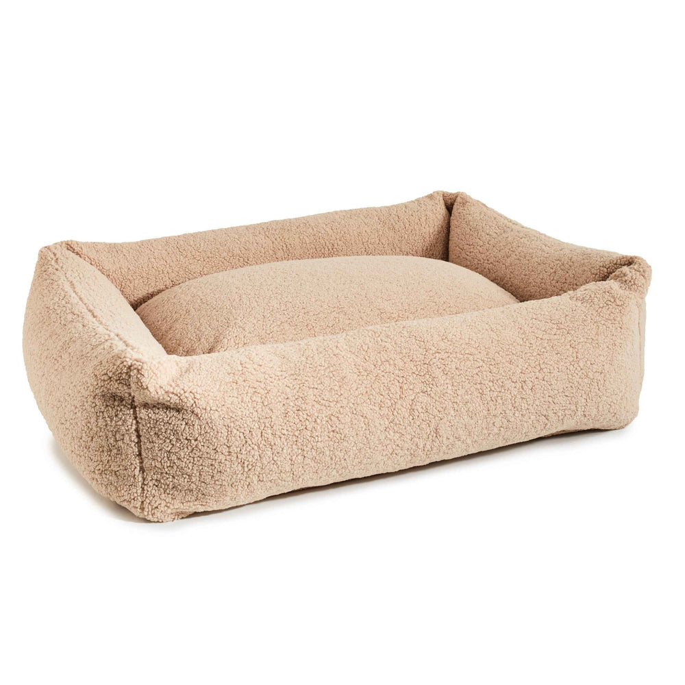 Beige, flauschiges CLASSIC Hundebett mit hohen Seitenwänden und gepolsterter Liegefläche für optimalen Komfort.